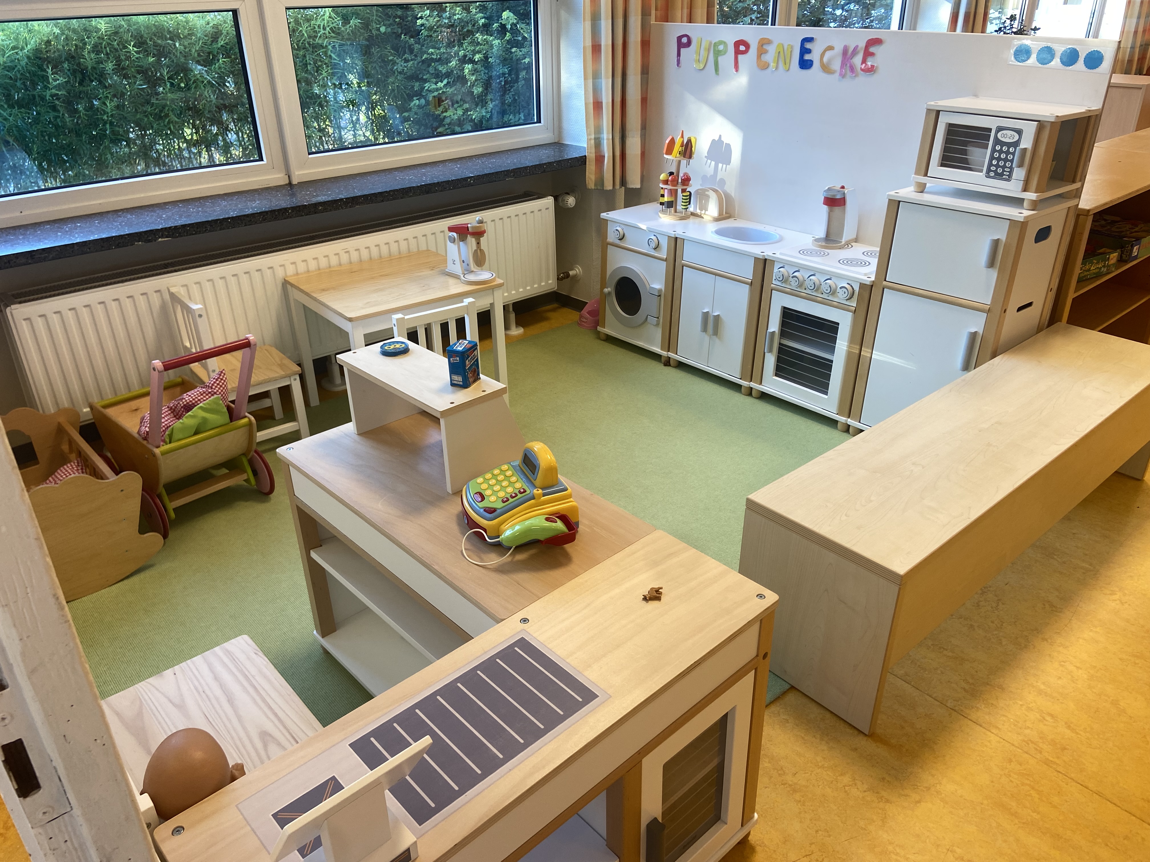 Auf dem Foto siehst du die Puppenecke der "Grünen Wichtelgruppe".